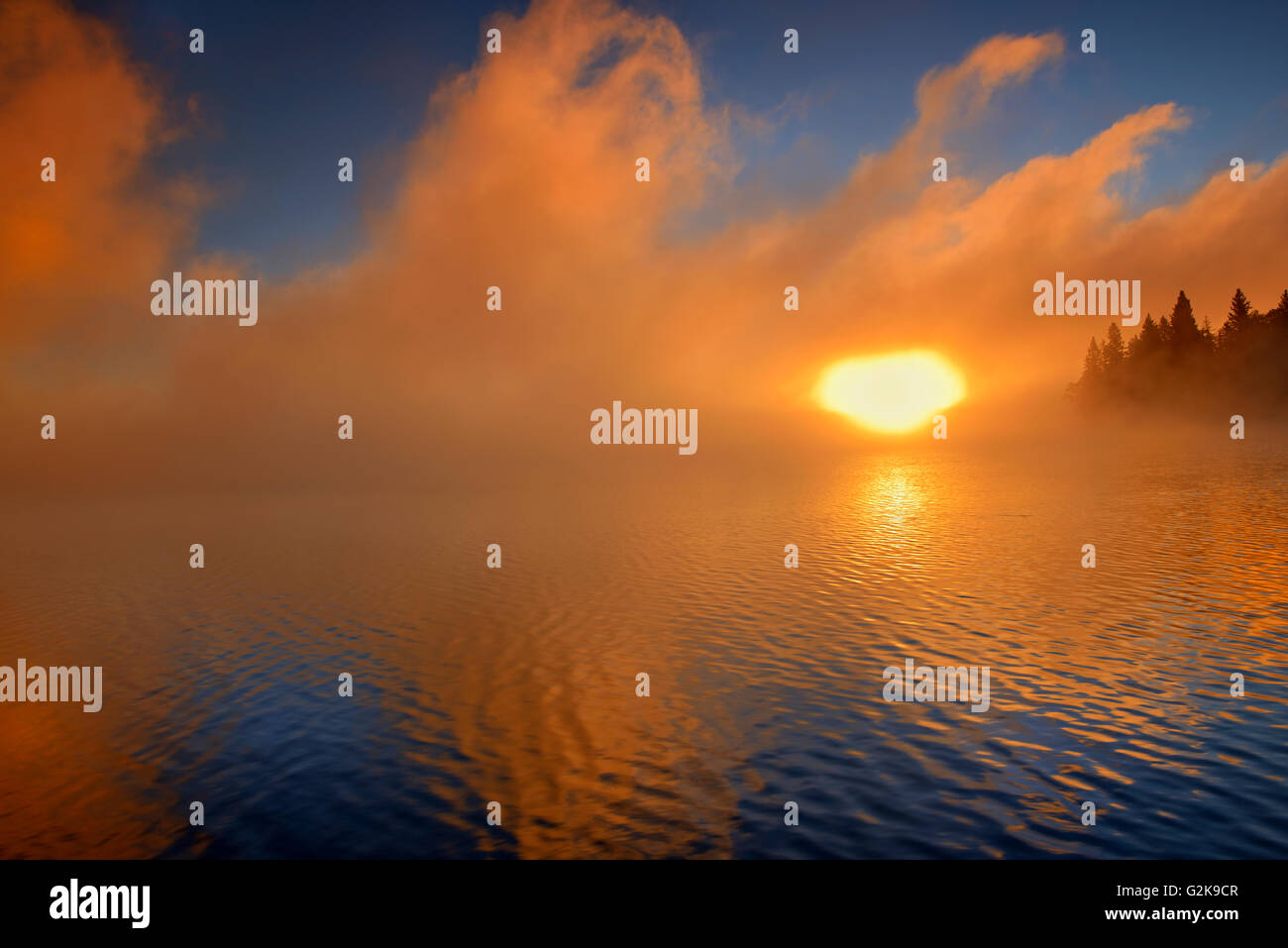 Fog at sunrise on Caddy Lake, Whiteshell Provincial Park, Manitoba, Canada Stock Photo