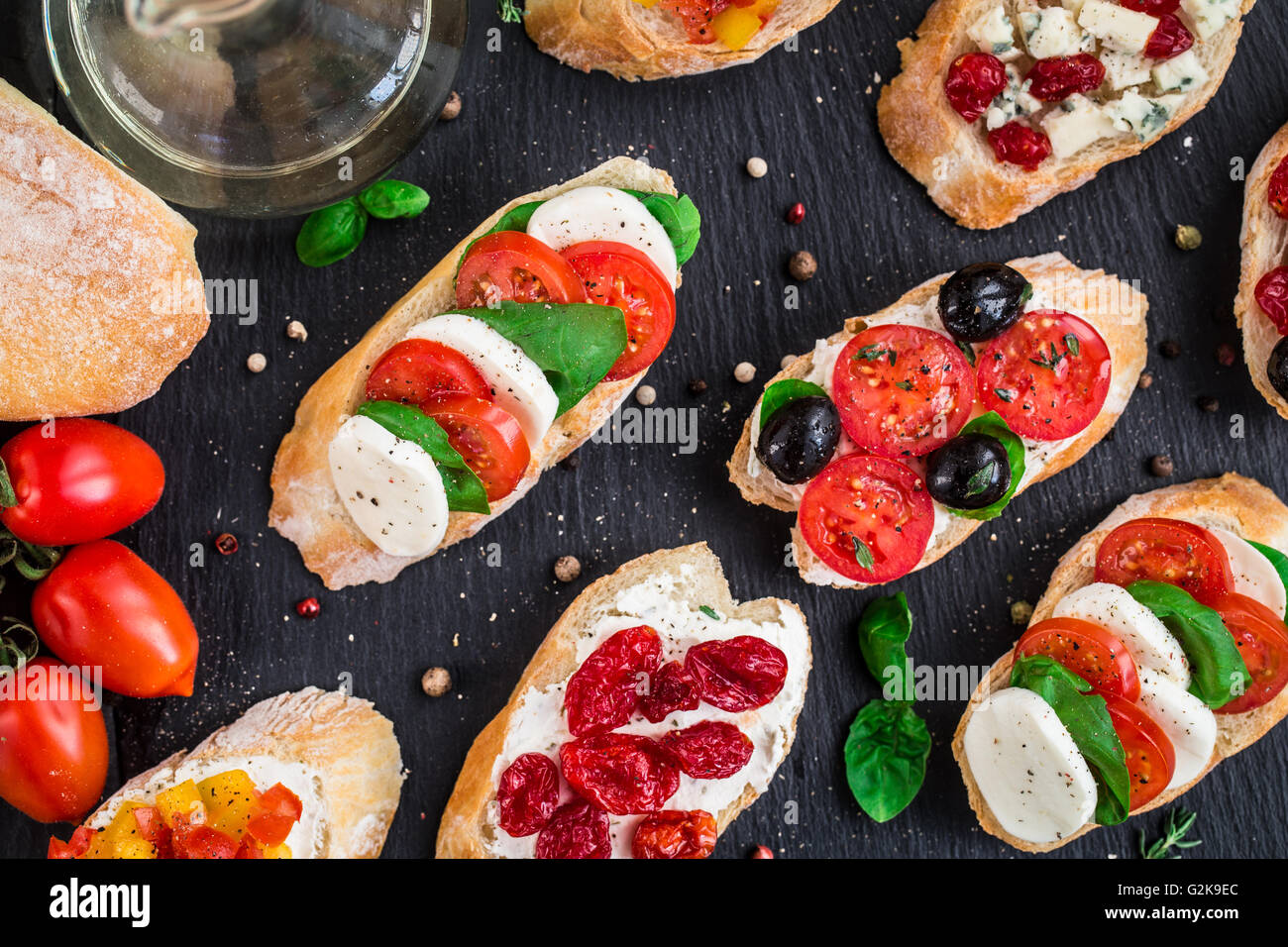 Bruschettas with tomatoes, herbs and olives Stock Photo