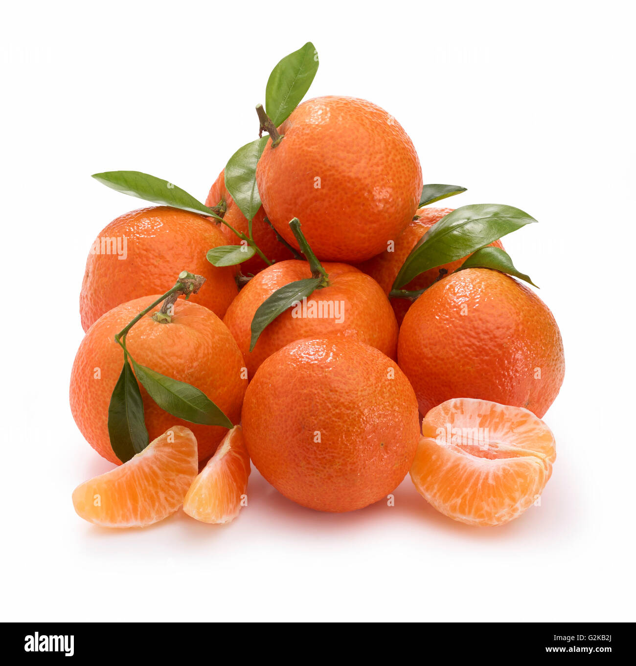 Mandarins (Citrus reticulata) with leaves, white background Stock Photo