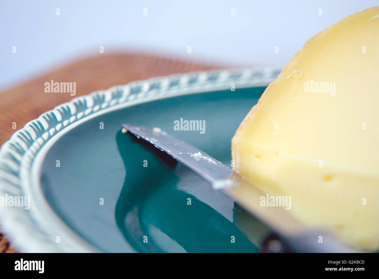 Cheese and a Knife on a Platter Stock Photo