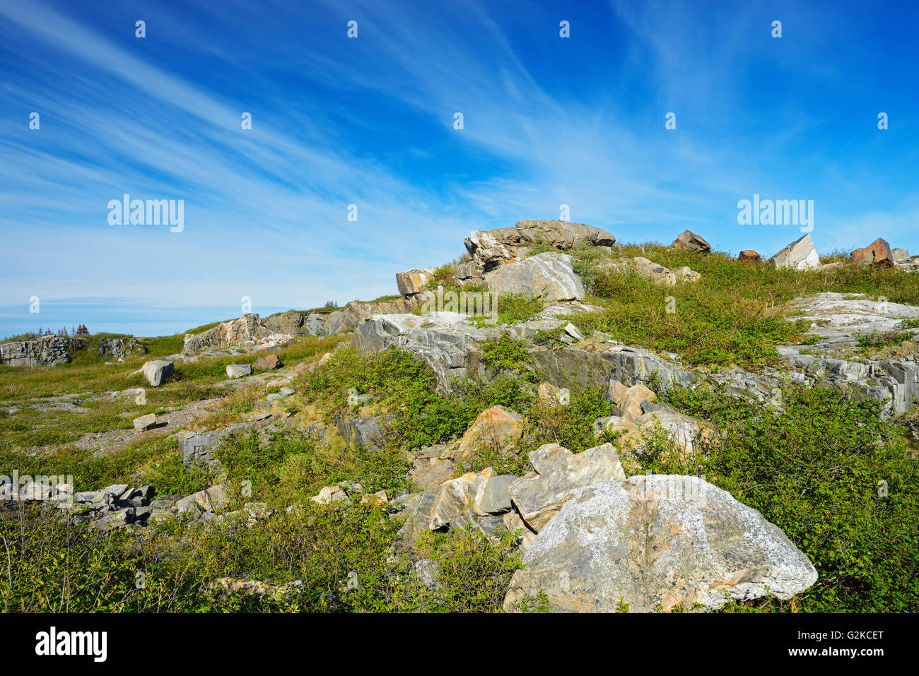 Rocky, barren landscape and clouds Iles aux Morts Newfoundland & Labrador Canada Stock Photo