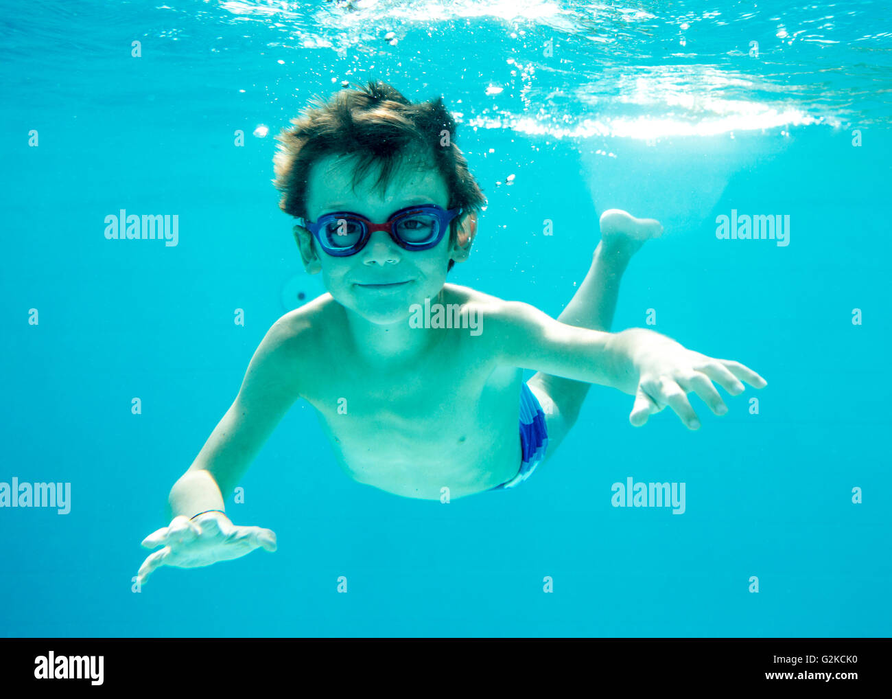 young boy diving underwater, swimming pool Stock Photo Alamy