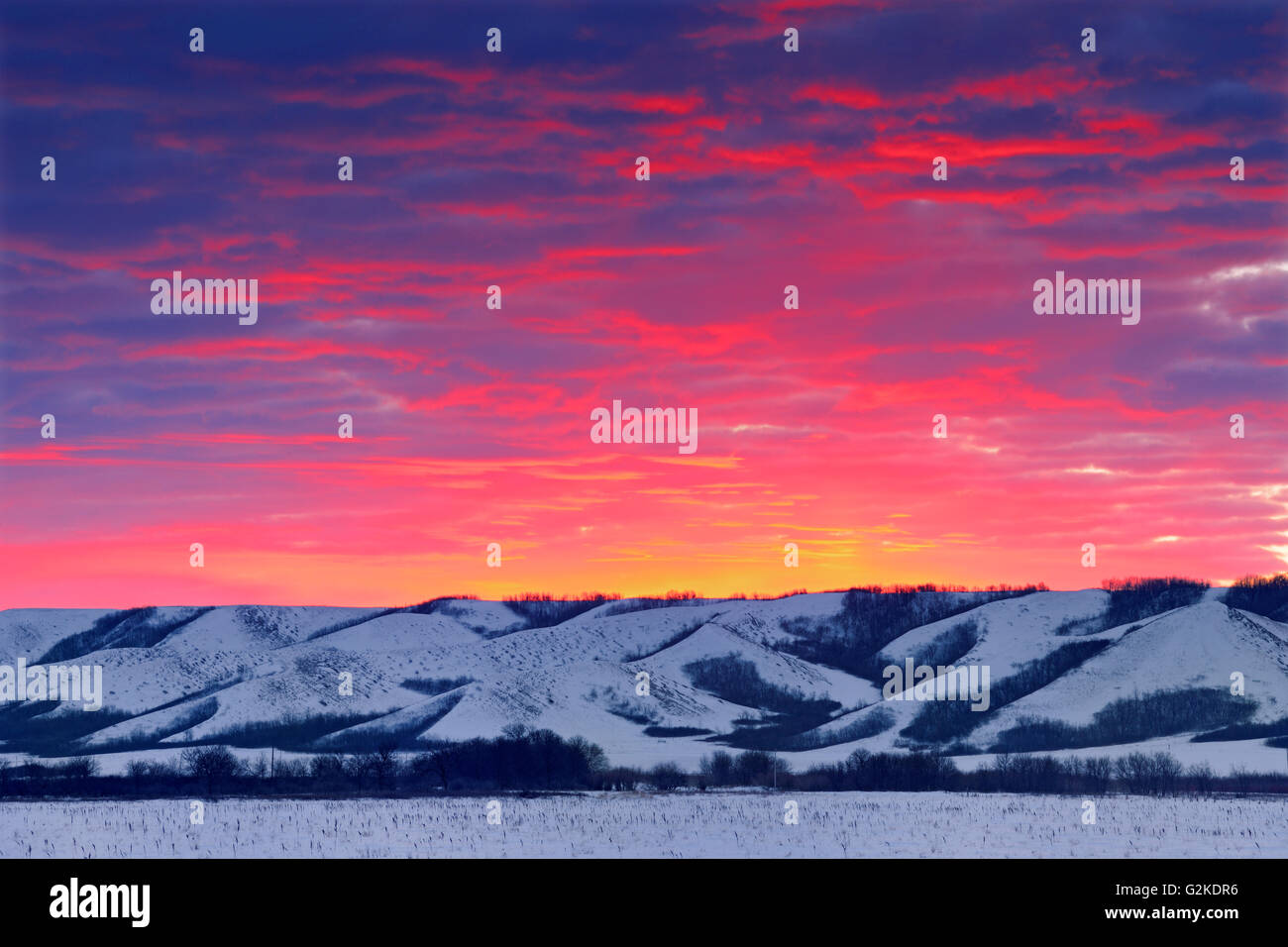 Dawn light on the hills of the Qu' Appelle Valley in winter near Craven  Saskatchewan Canada Stock Photo