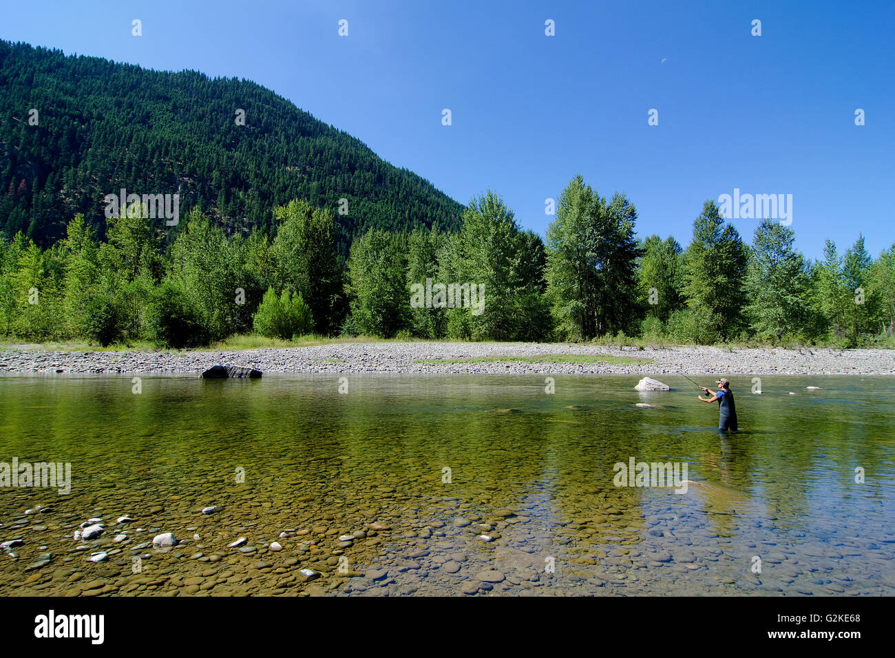 Woman fly fishing the Similkameen River, near Princeton in the