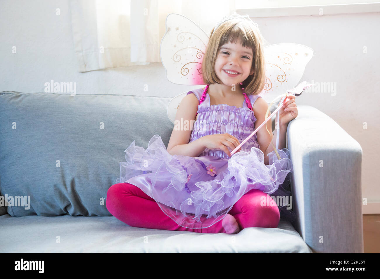 Portrait of happy little girl dressed up as fairy queen Stock Photo Alamy