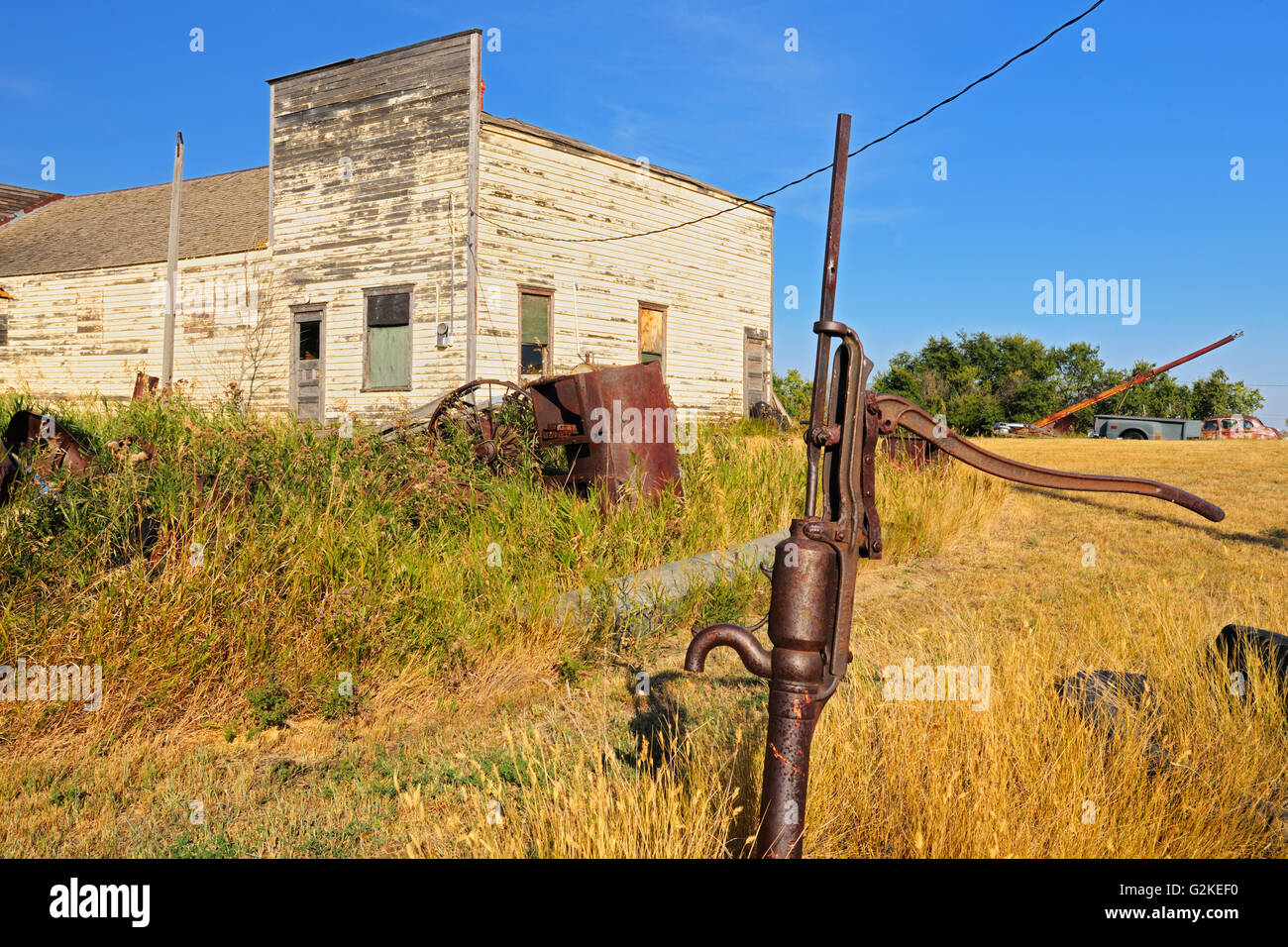 Old water pump and buildings in ghost town of Laverna Laverna Saskatchewan Canada Stock Photo