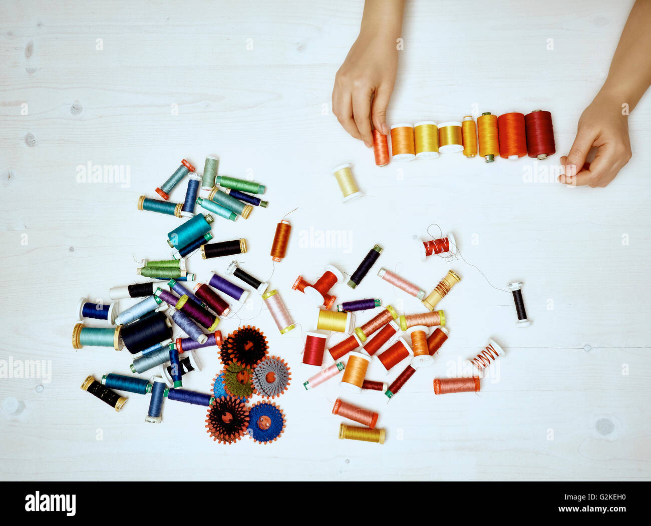 Hand sorting sewing utensils Stock Photo - Alamy