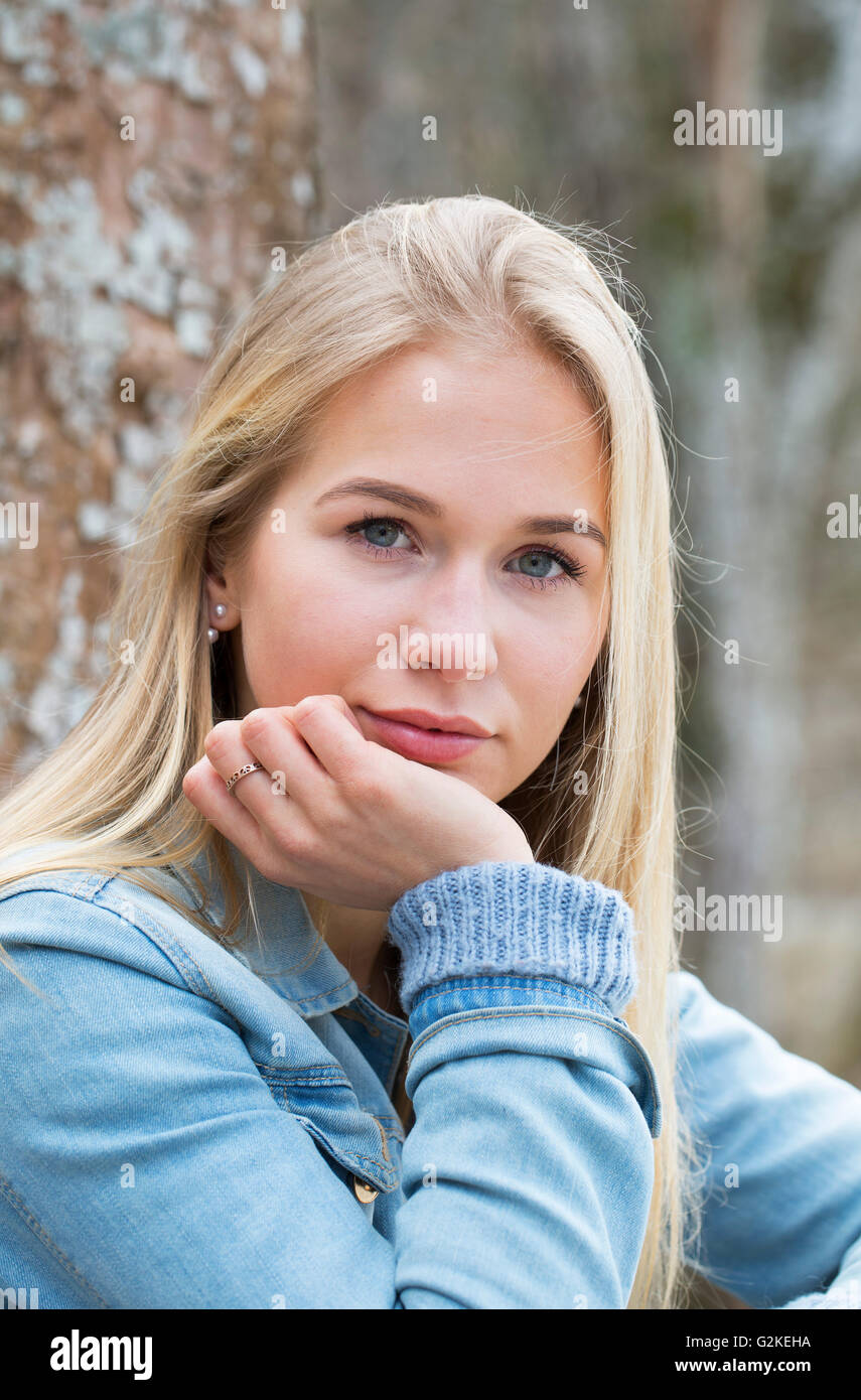 Portrait of pensive teenage girl Stock Photo - Alamy