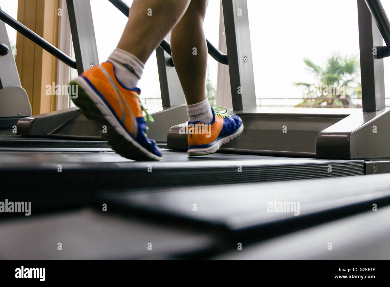 Man running on a treadmill, sport shoes Stock Photo Alamy