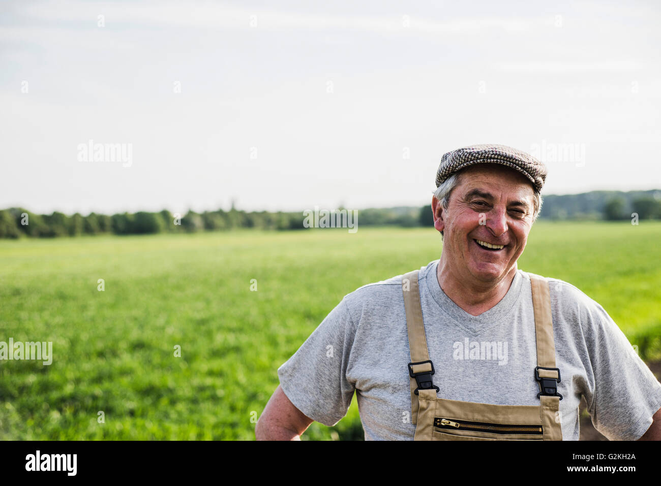 Portrait of smiling farmer at a field Stock Photo - Alamy