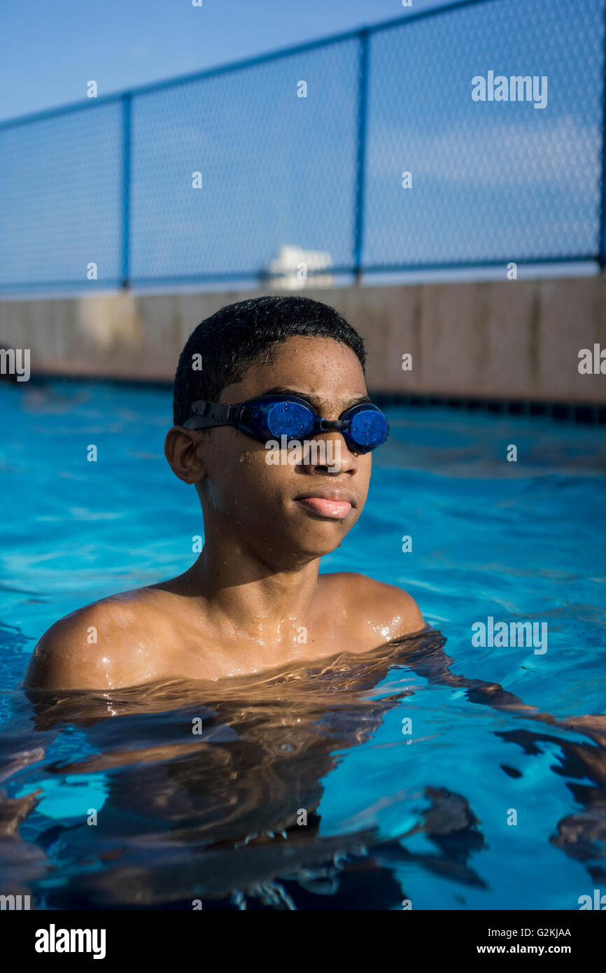 Teenage boy in swimming pool Stock Photo Alamy