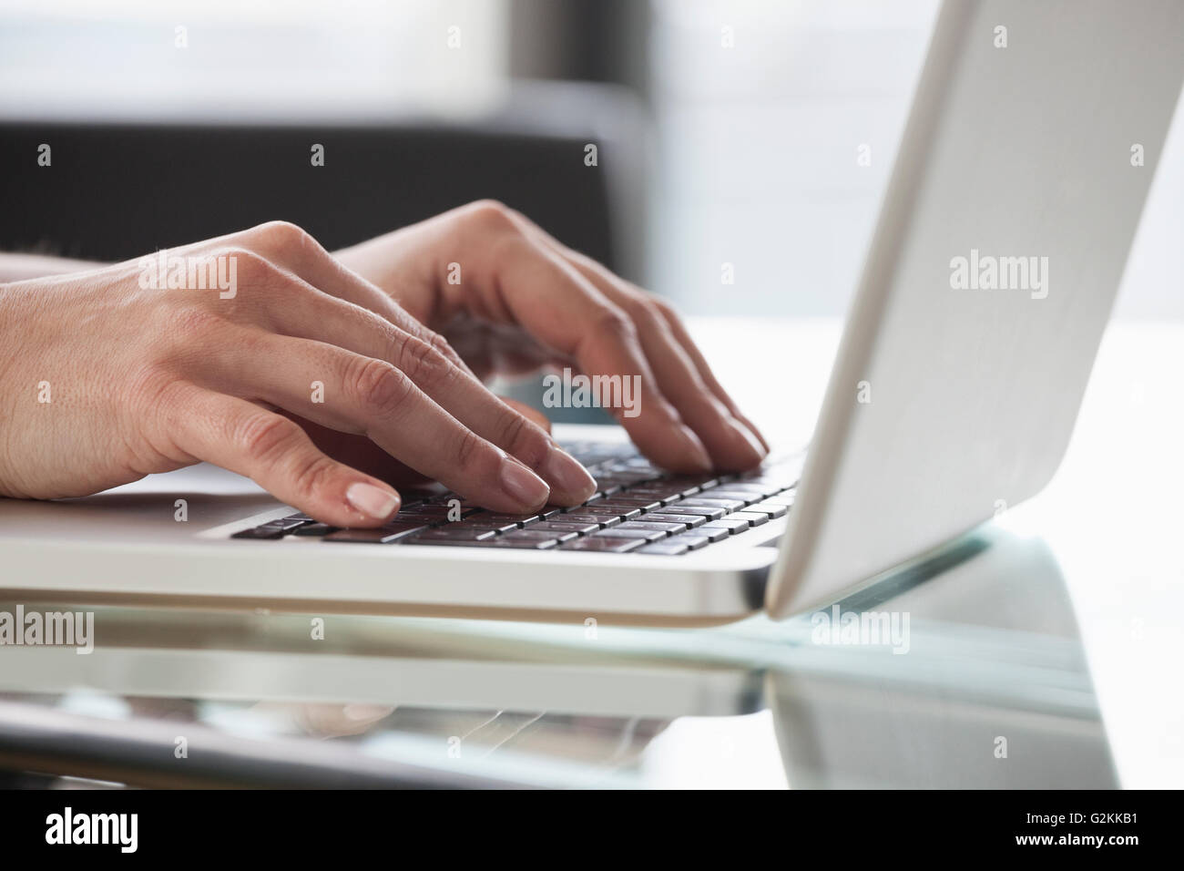 Close-up of woman's hands using laptop Stock Photo