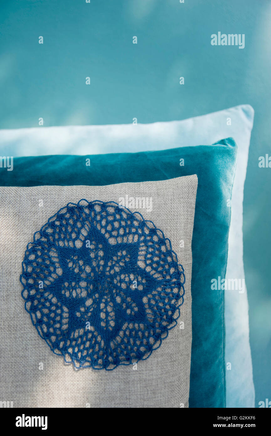 Cushion with applicated crochet tablecloth Stock Photo - Alamy