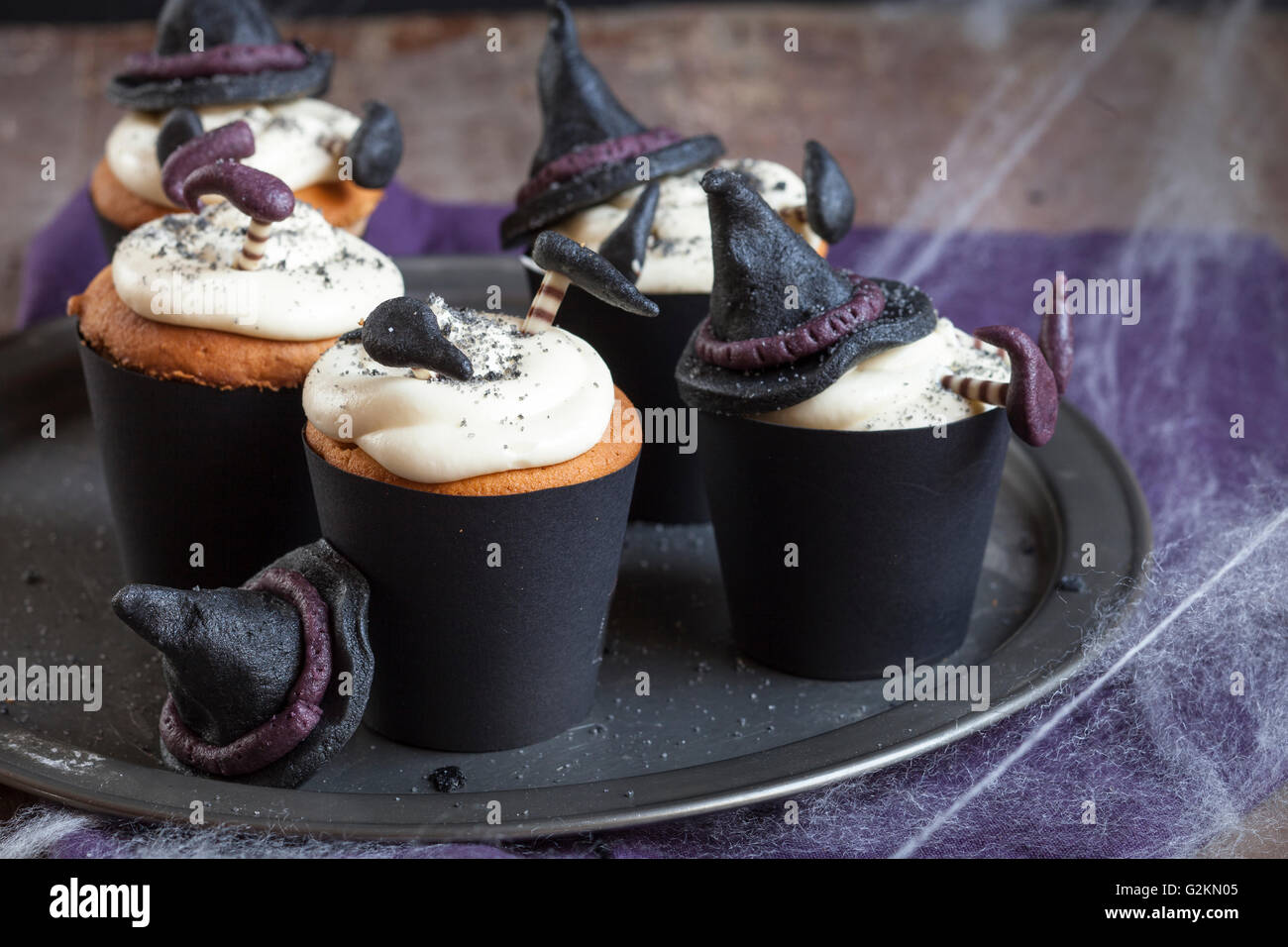 Halloween cupcakes with crashed witches topping Stock Photo