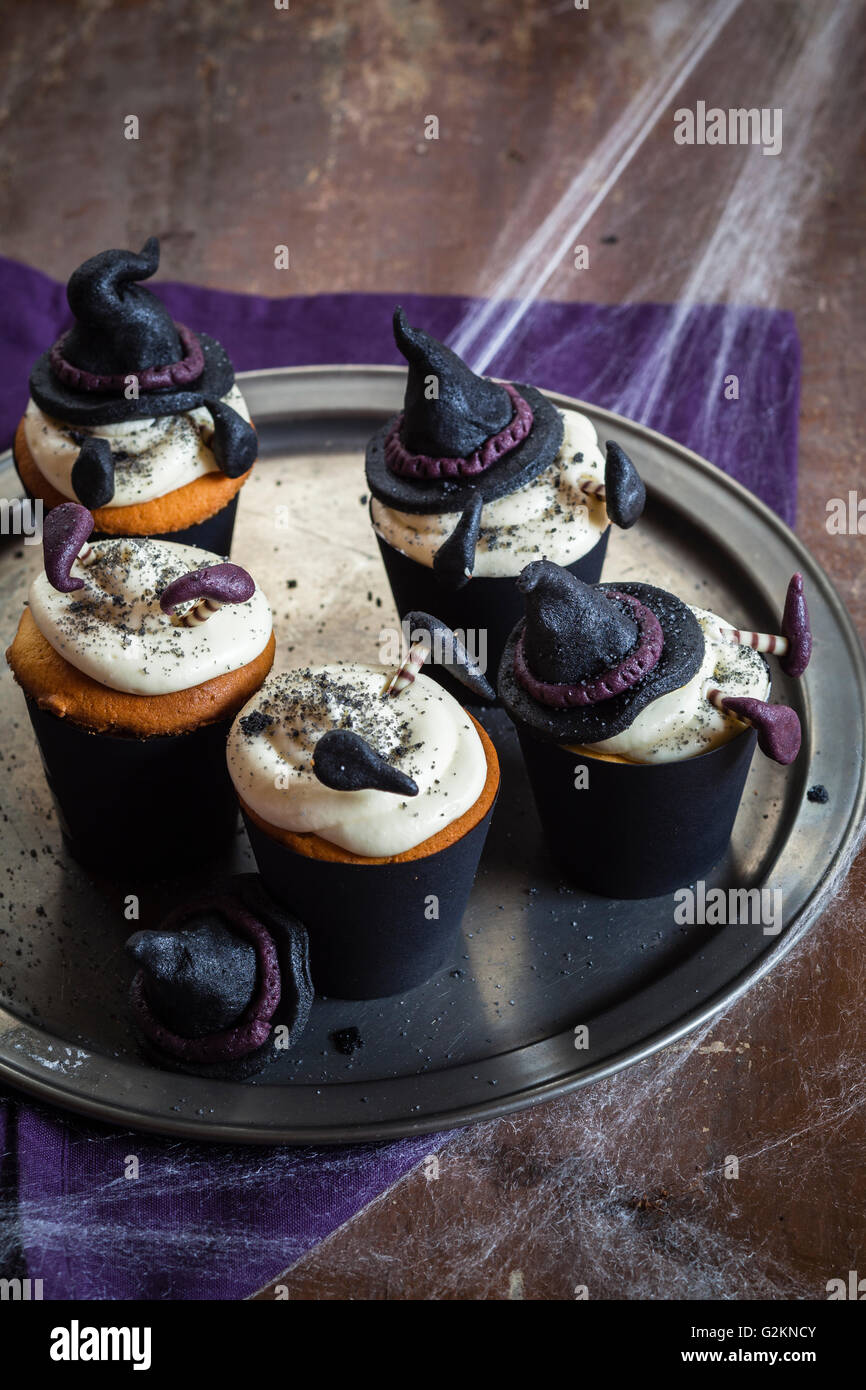 Halloween cupcakes with crashed witches topping Stock Photo