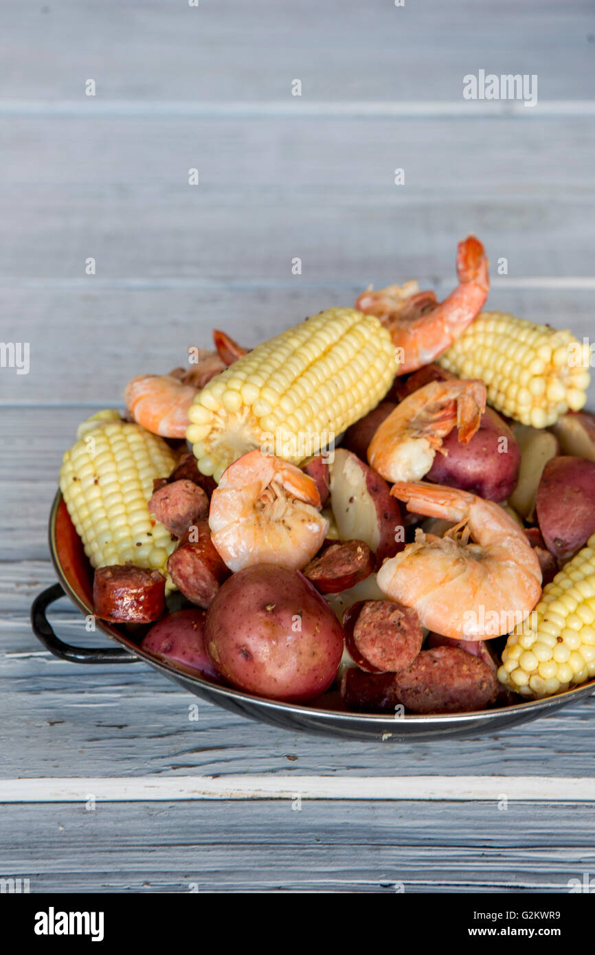 Low Country Boil with Shrimp, Corn, Sausage and Potatoes on Plate Stock Photo