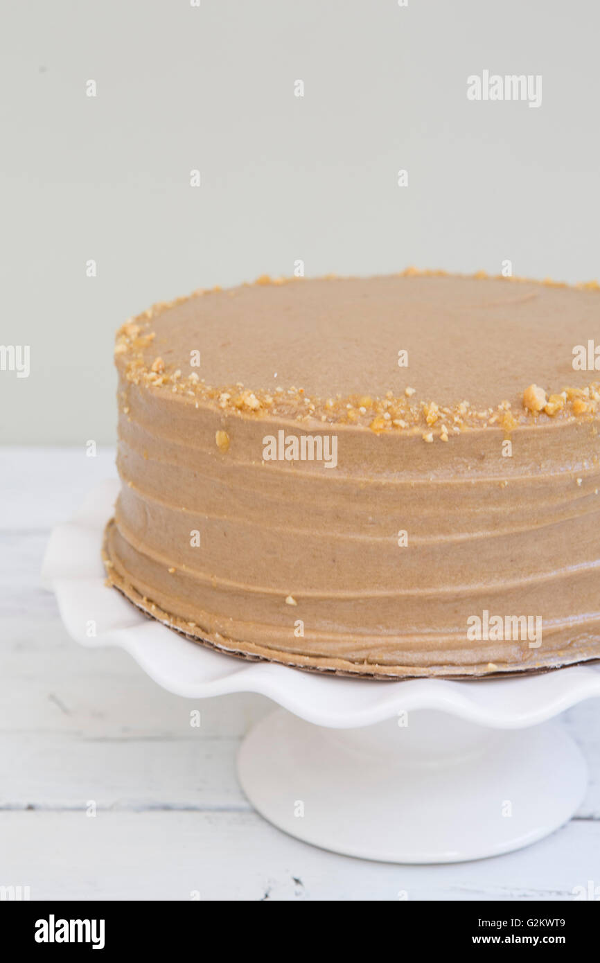 Cake with Chocolate Icing and Peanut Brittle Stock Photo Alamy