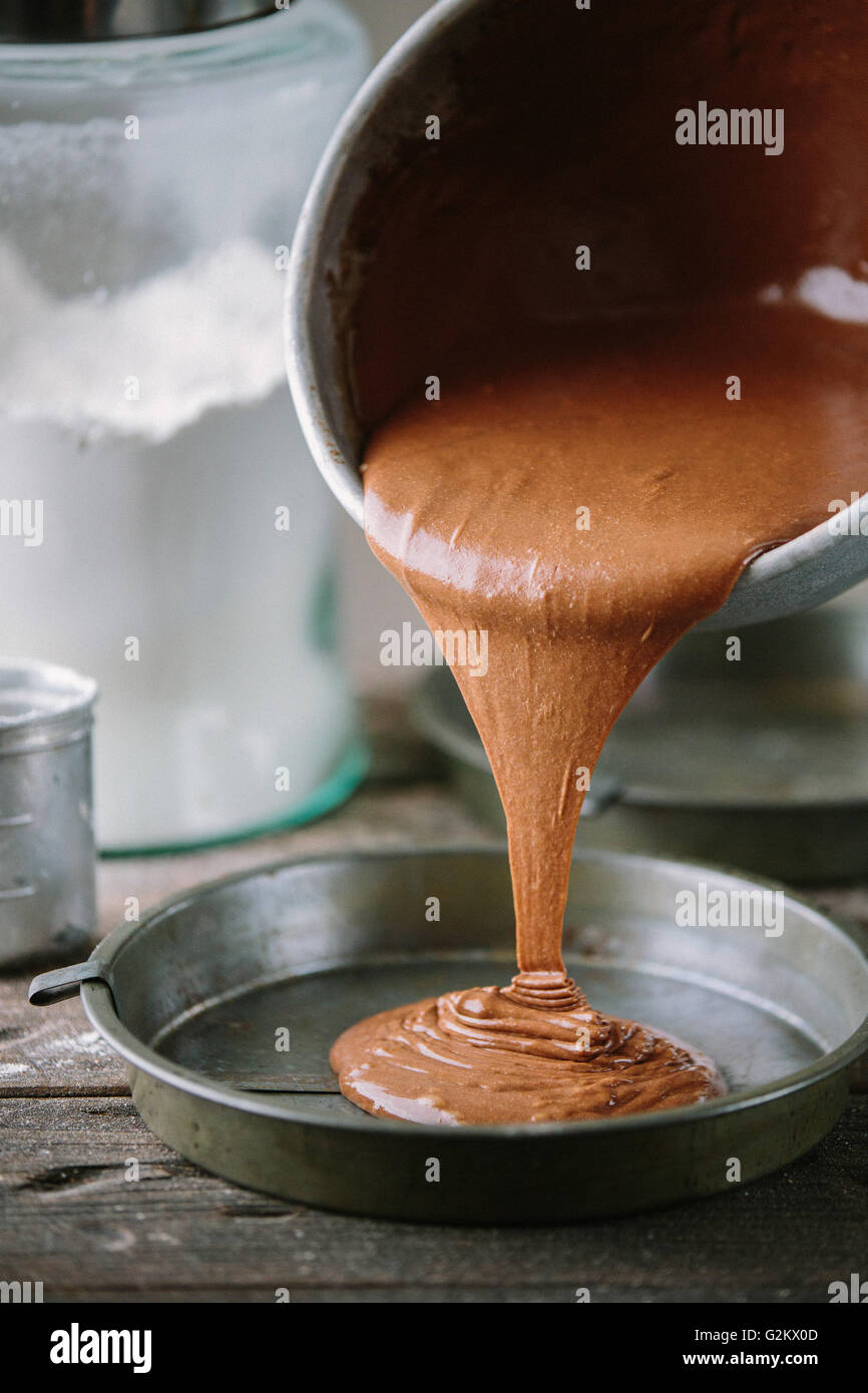 Cake Batter Being Poured into Cake Tin Stock Photo Alamy