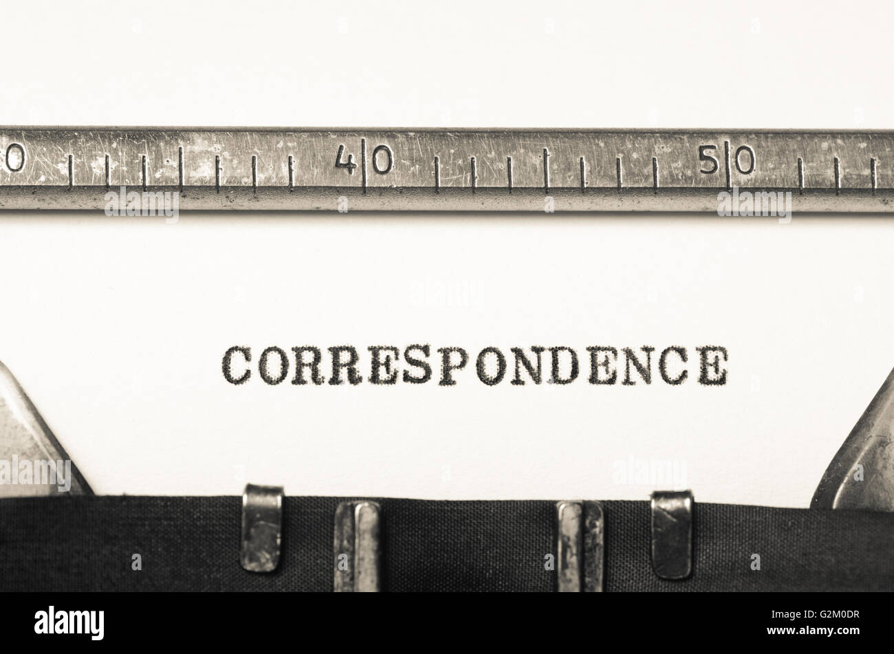 Word correspondence typed on an old typewriter Stock Photo