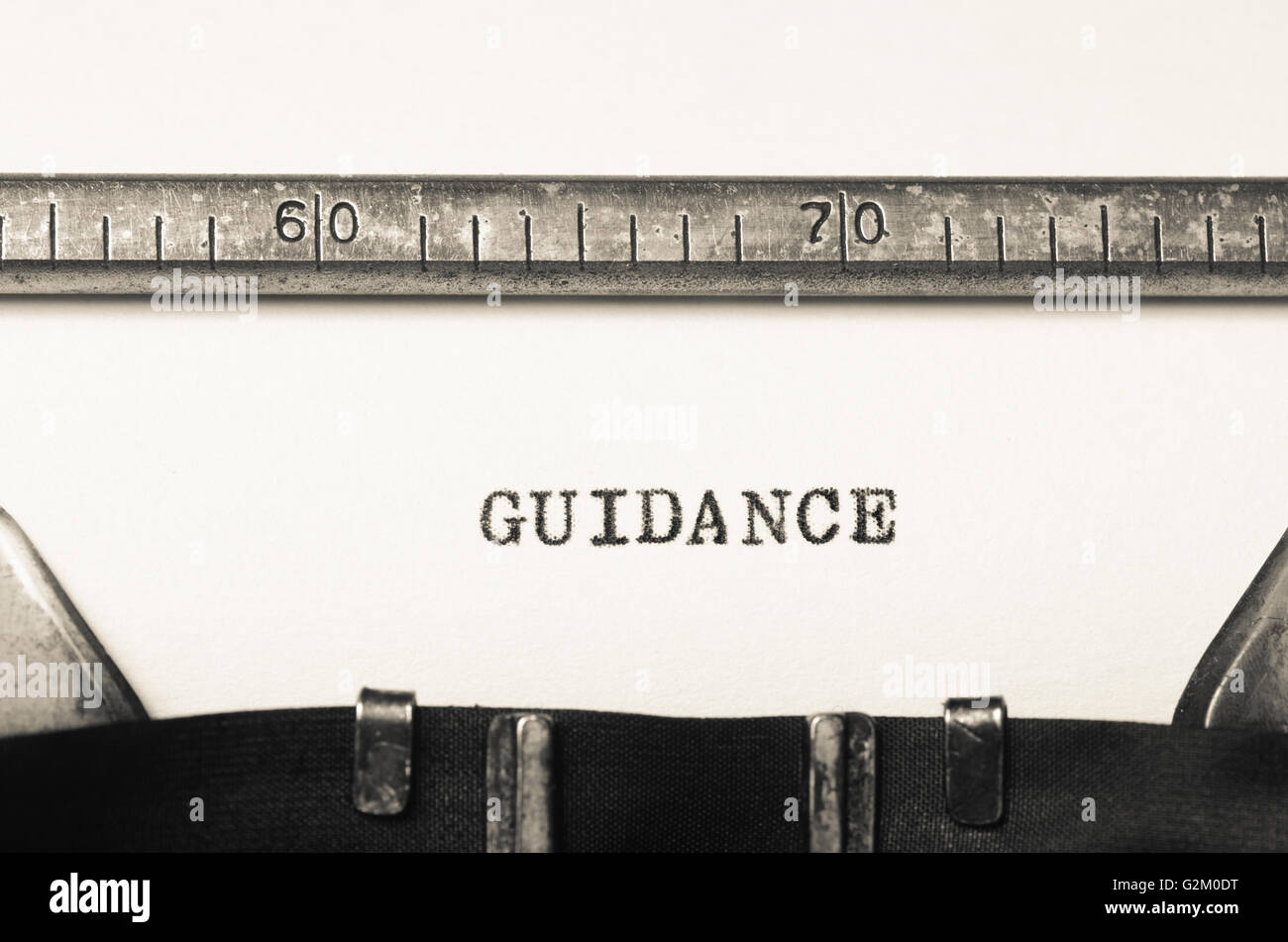 Word Guidance Typed On An Old Typewriter Stock Photo Alamy
