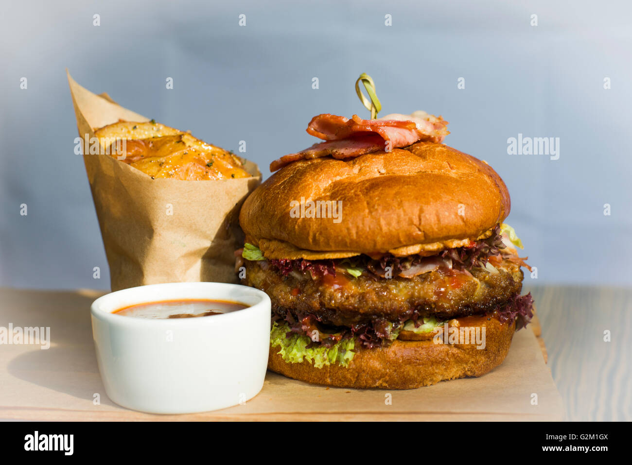 Hamburger, topped with ham Stock Photo