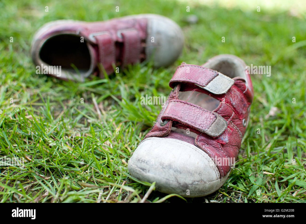 children's shoes on grass Stock Photo