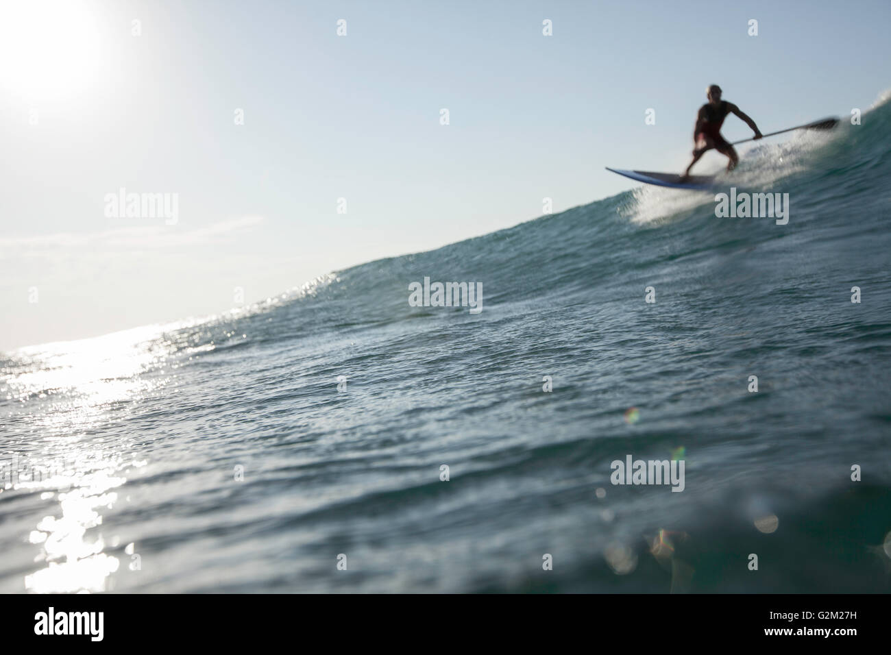 Davide Giardini stand up paddle boarding, surfing off of Diamond Head