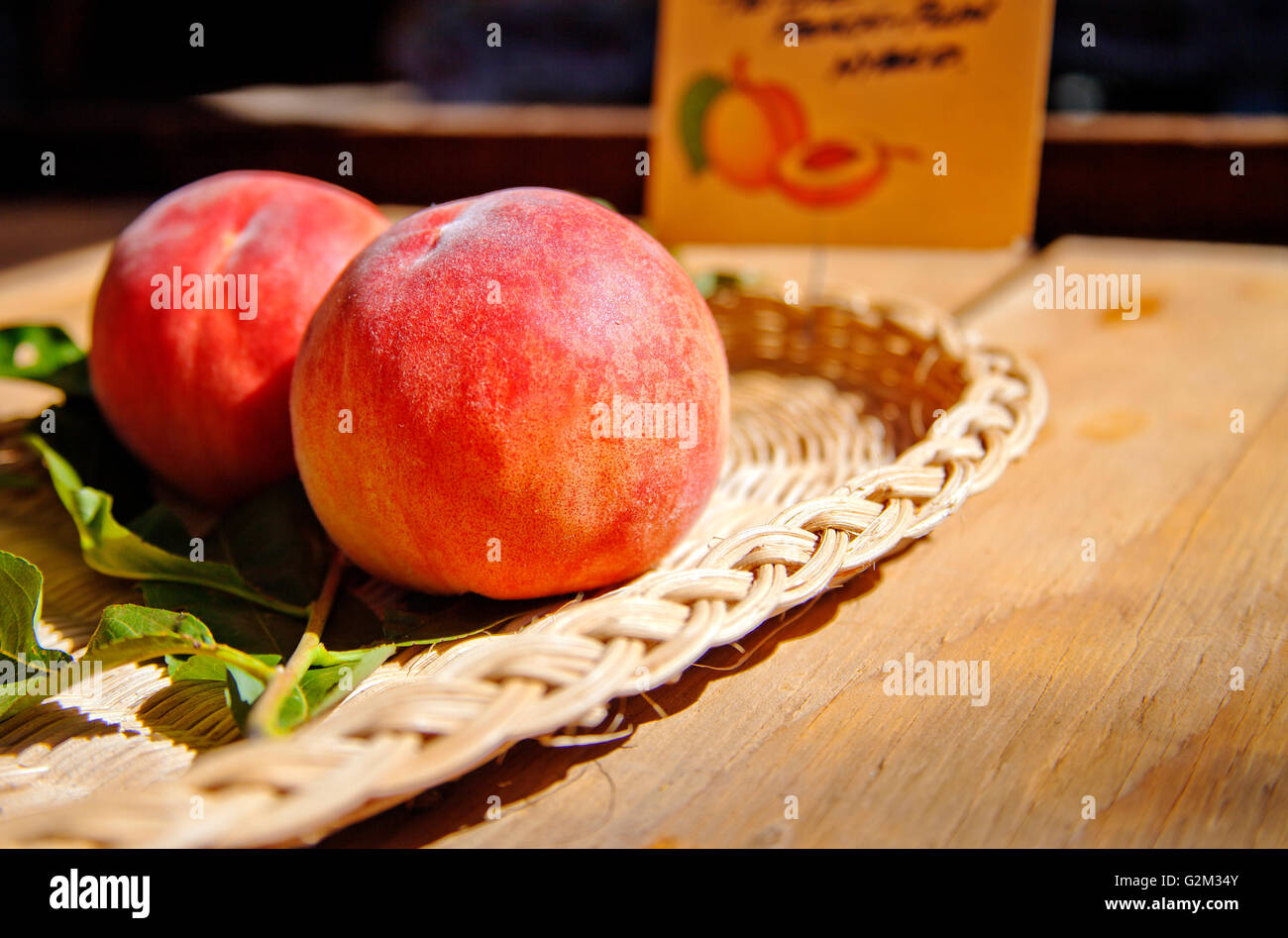 Peaches in Basket. The latest harvest of the season Stock Photo Alamy