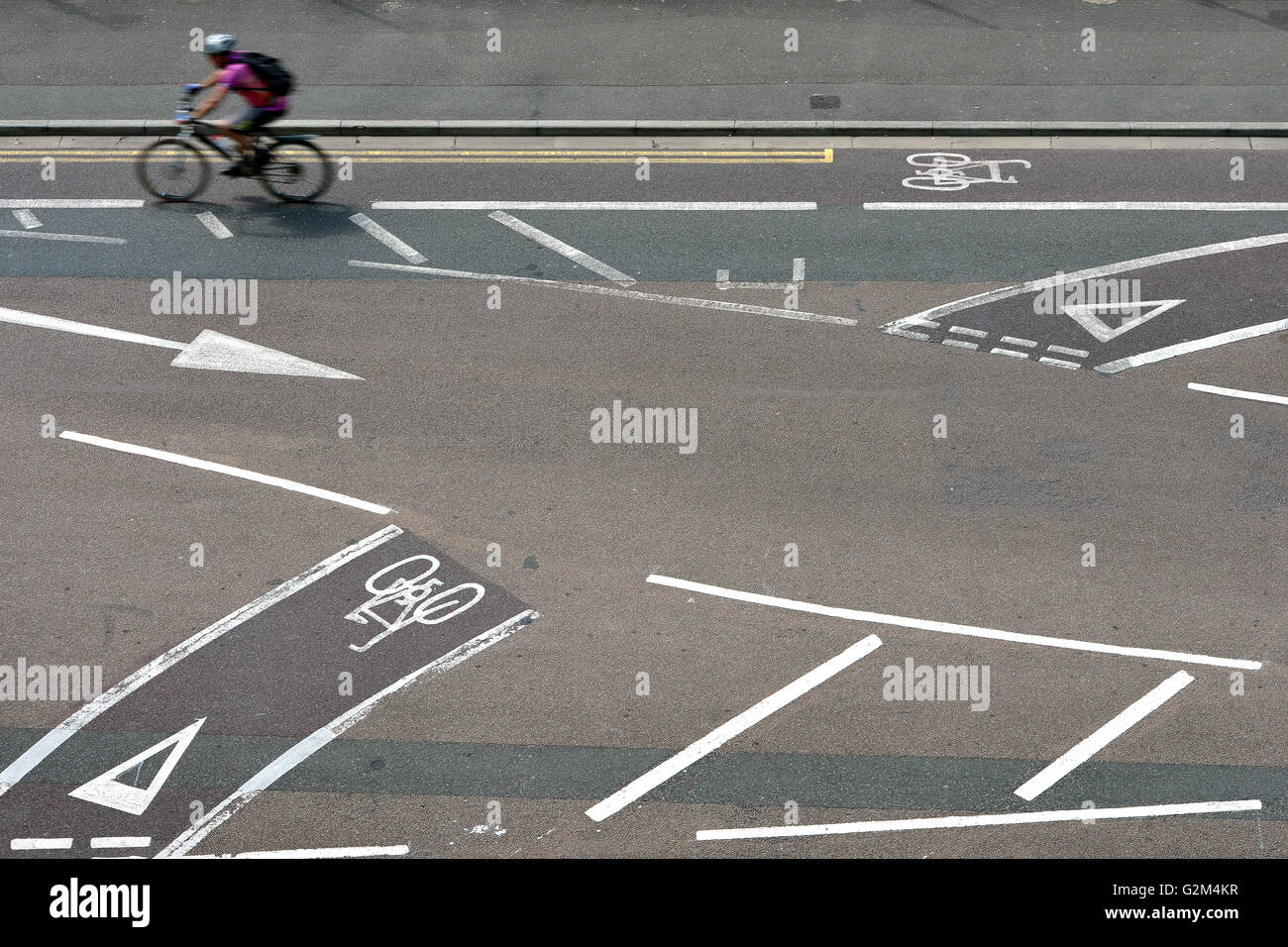 Cyclist using cycle lanes on road Stock Photo Alamy