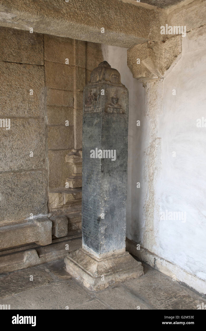 Carved inscriptions in Kannada on the stone pillar at the entrance of