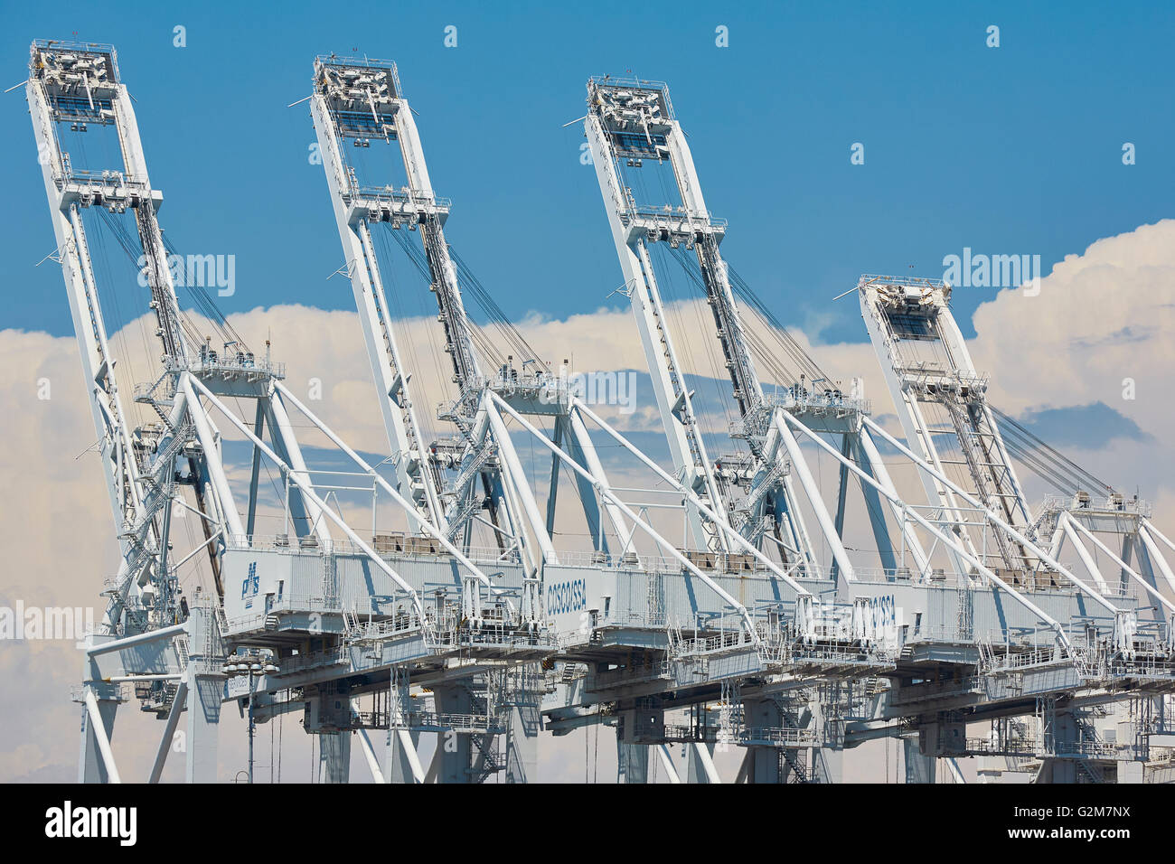Shipping Container Cranes At Long Beach Container Terminal With Towering Cumulonimbus Storm Clouds In The Background. Stock Photo