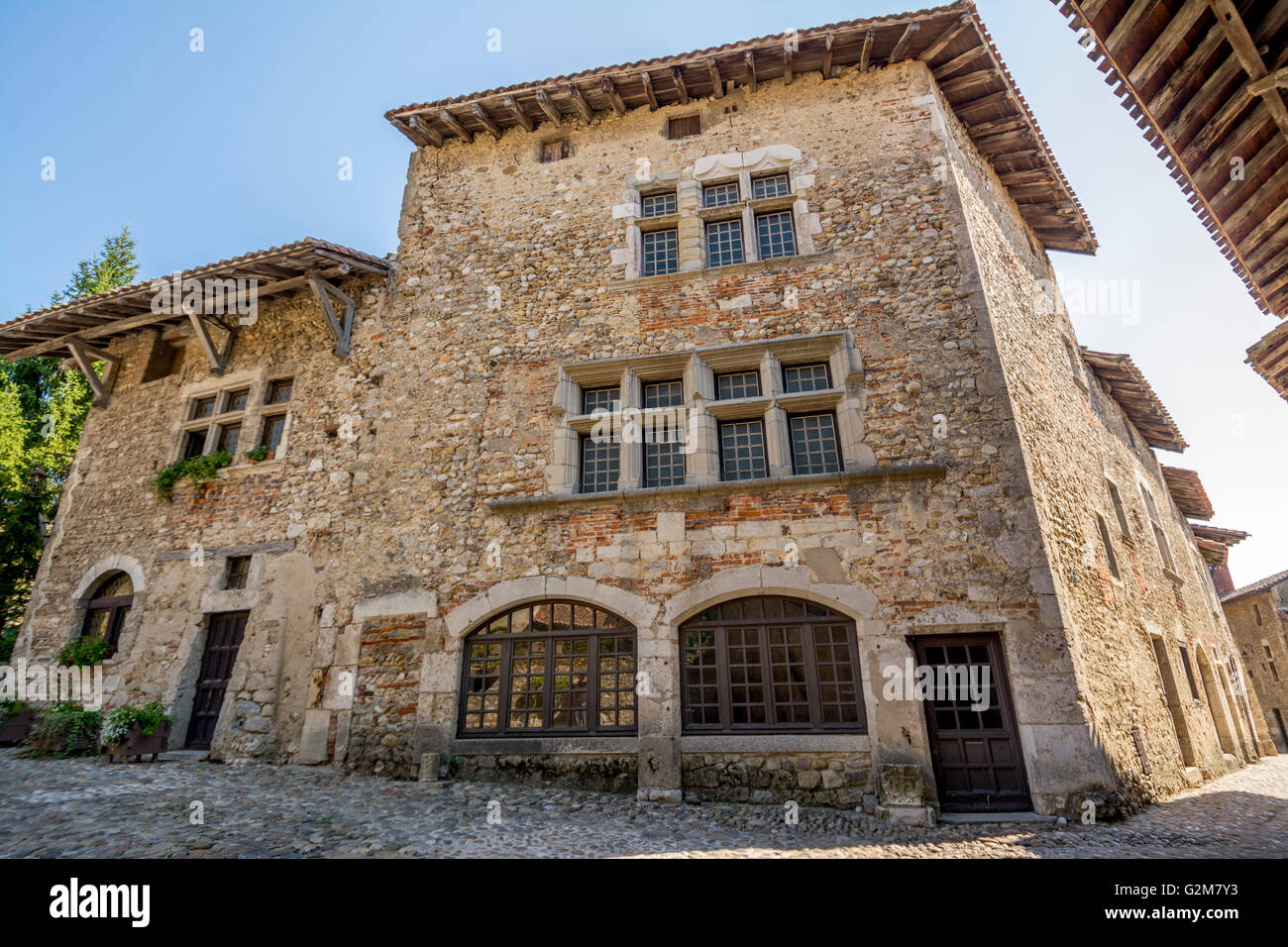 Cobblestone street, medieval walled town of Perouges labelled les Plus ...