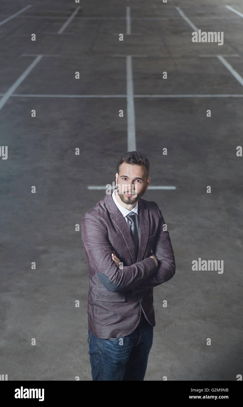Smiling business man standing outside office building Stock Photo - Alamy