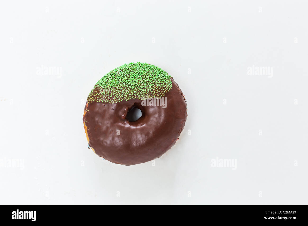 Donut with sprinkles isolated on white background Stock Photo - Alamy