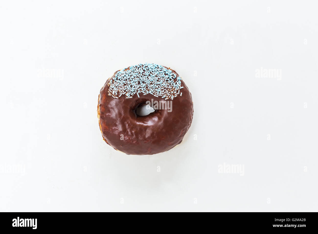 Donut with sprinkles isolated on white background Stock Photo - Alamy