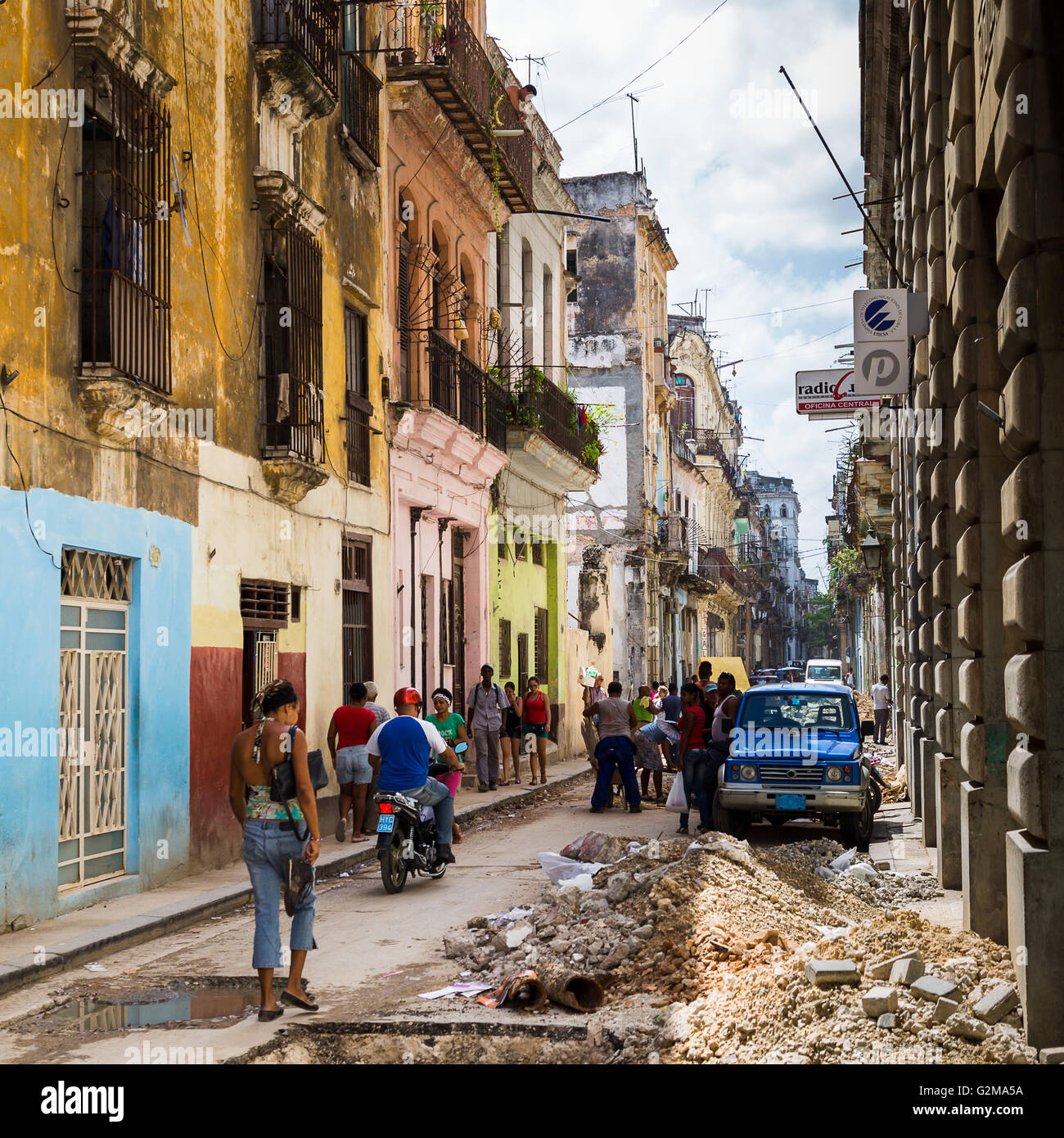 Road works taking place on a narrow road in the Cuban capital, Havana. Stock Photo