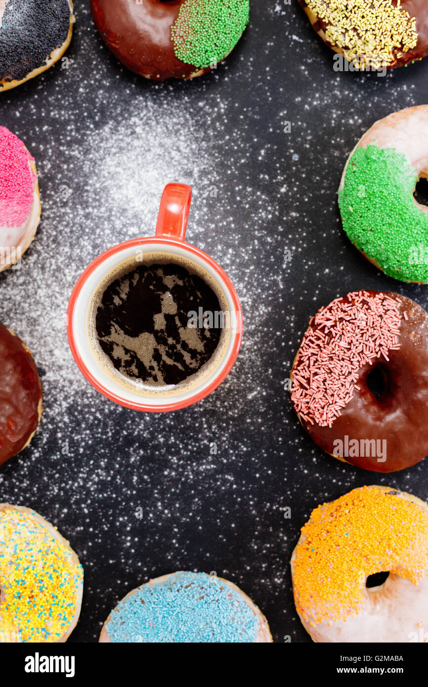 Donuts and coffee on stone table. Top view with copy space Stock Photo ...