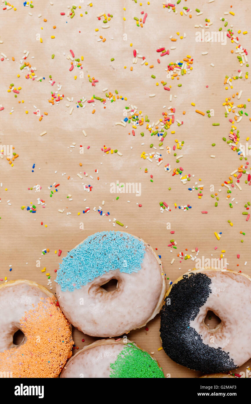 Colorful donuts on paper background Stock Photo - Alamy
