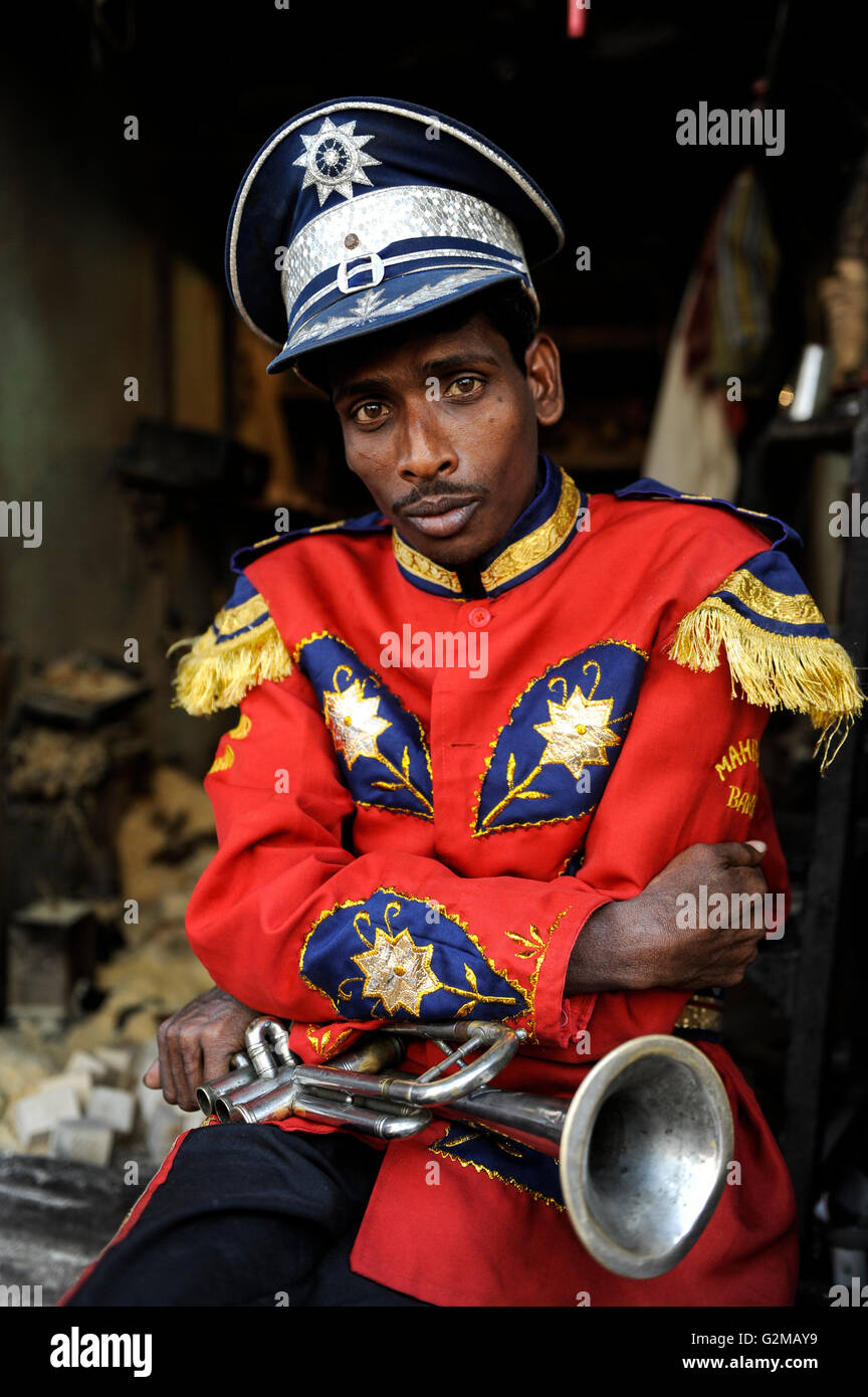 INDIA Westbengal, Kolkata, portraiture of musician with trumpet, he is