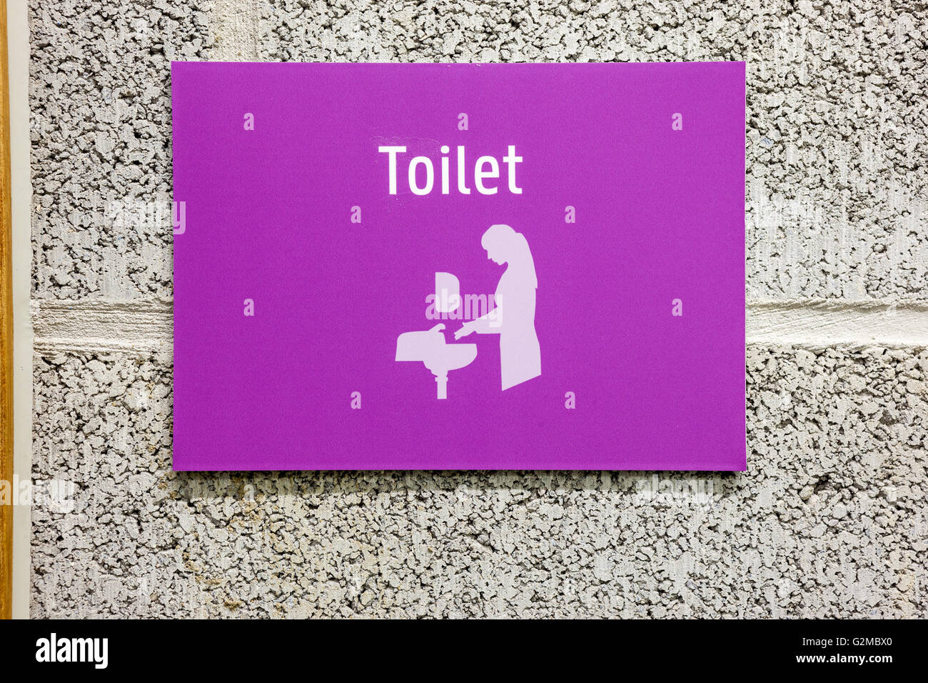 to the toilet there's an toilet designation Stock Photo