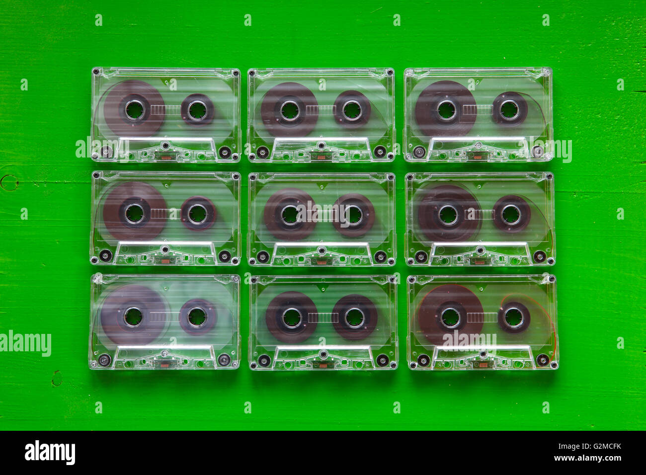 Set of old audio cassettes on wooden table.Retro plastic audio cassette