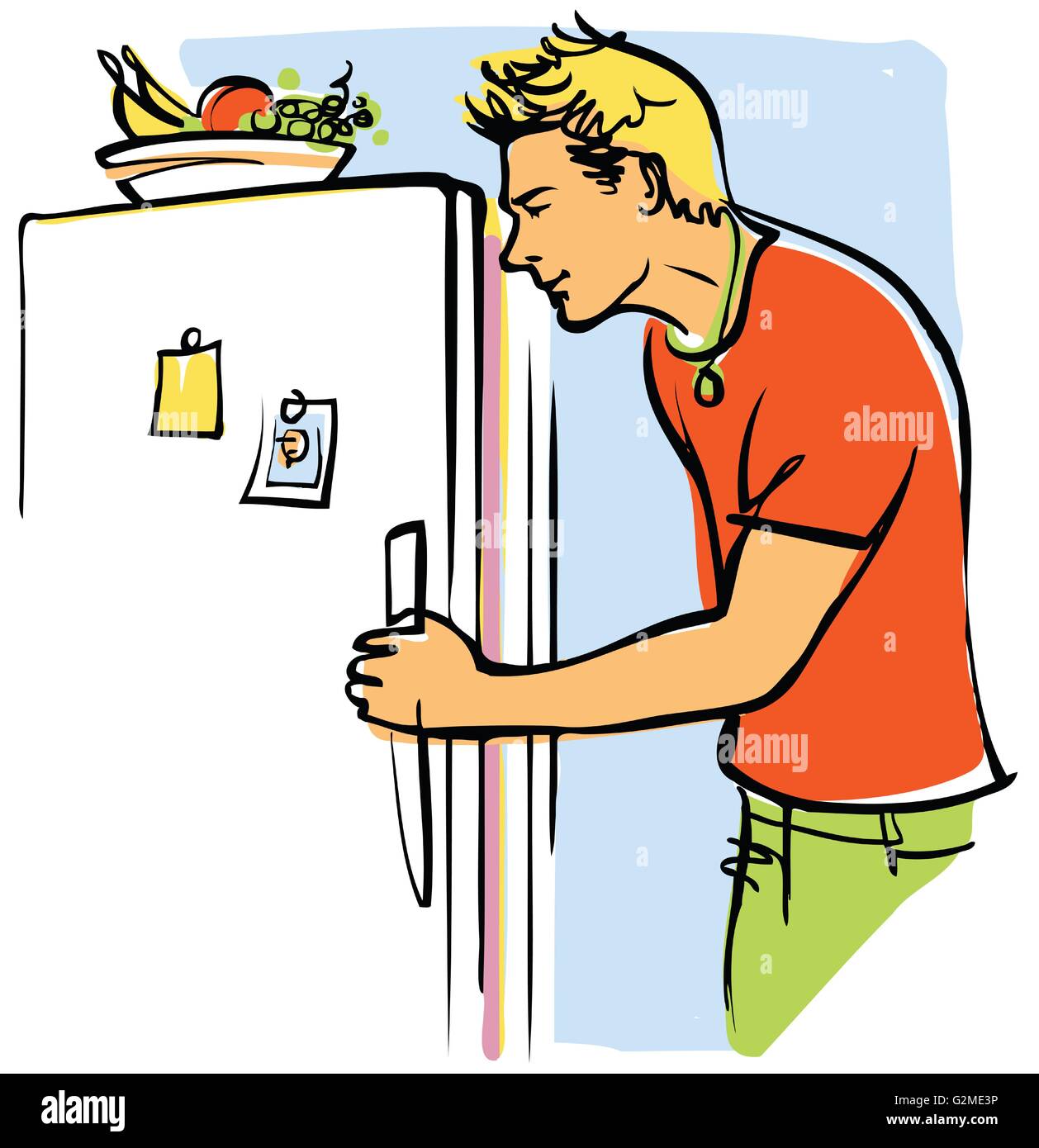Young man looking into fridge Stock Photo