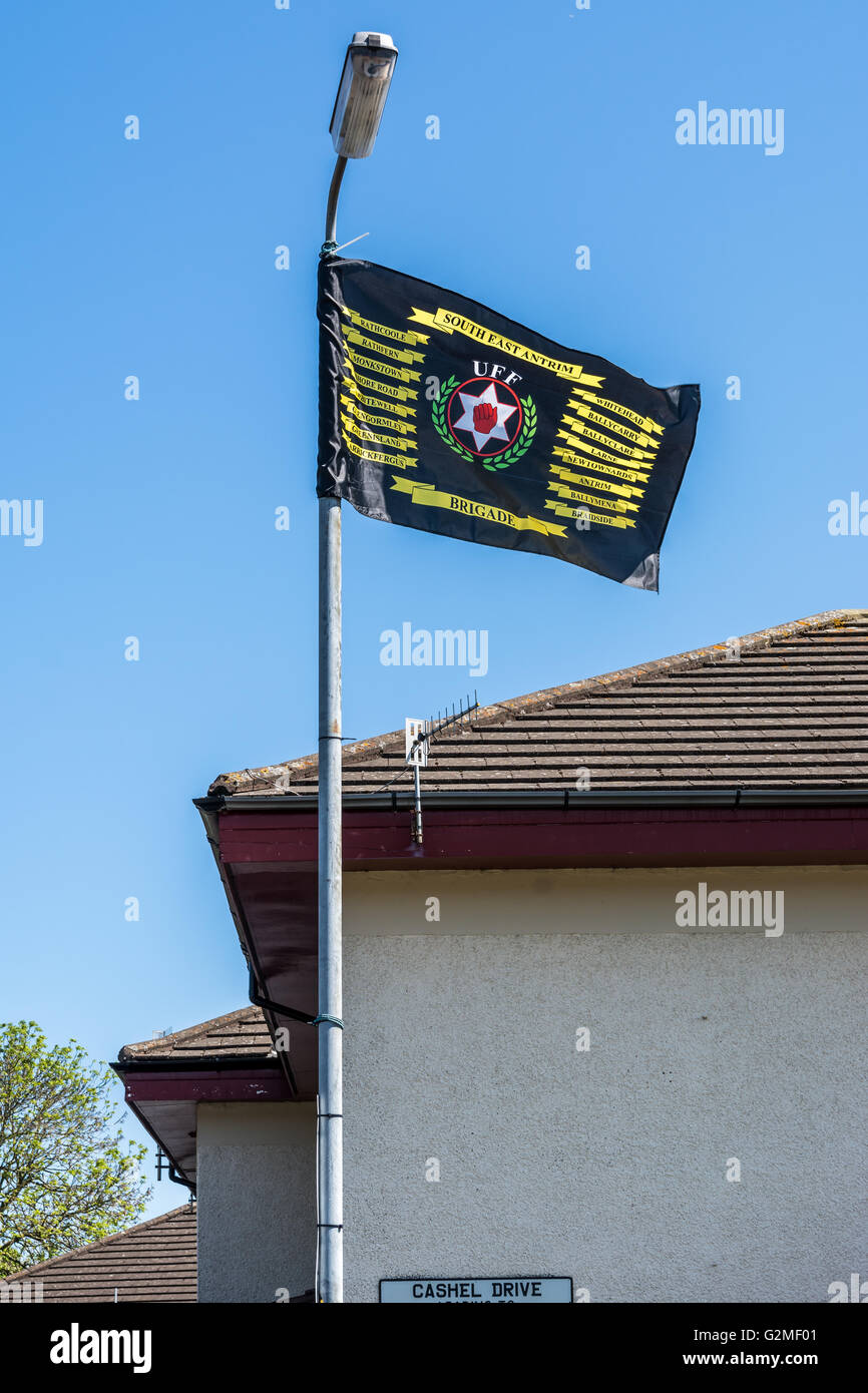 Ulster Freedom Fighters South East Antrim Brigade flag flying from lamppost in loyalist Monkstown estate. Stock Photo