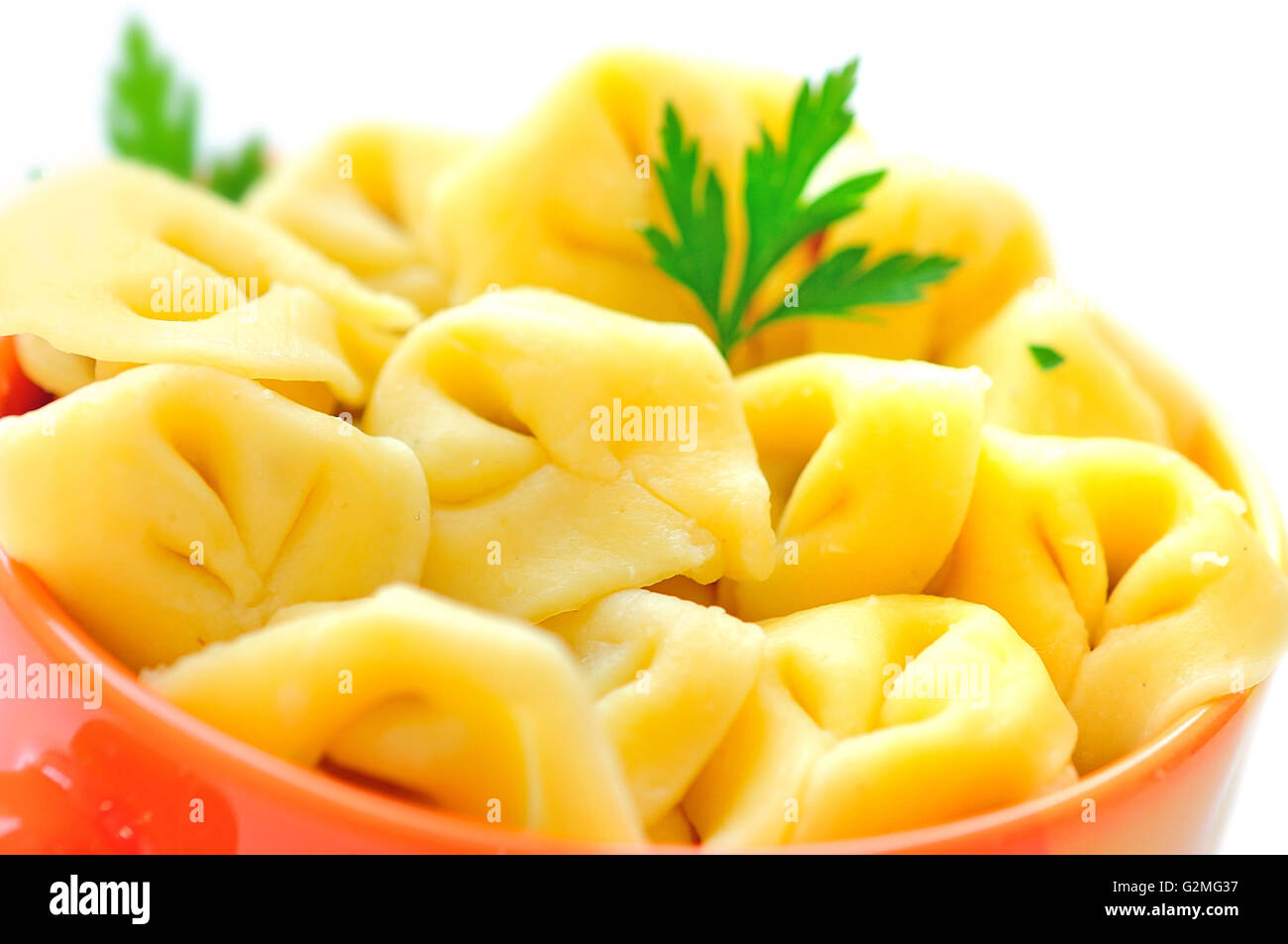 Bowl with tortellini on background Stock Photo