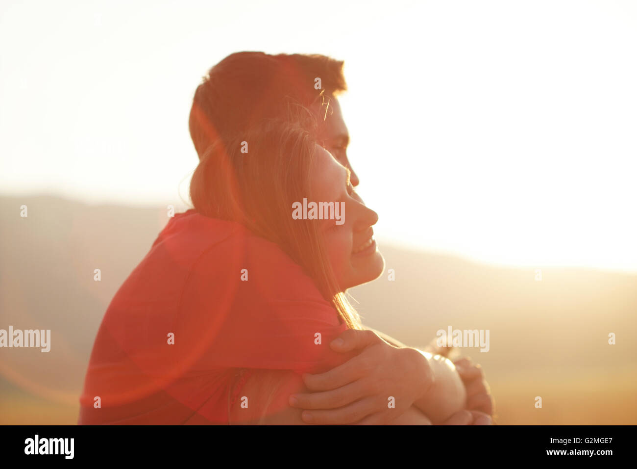 silhouette of a loving couple at sunset Stock Photo - Alamy