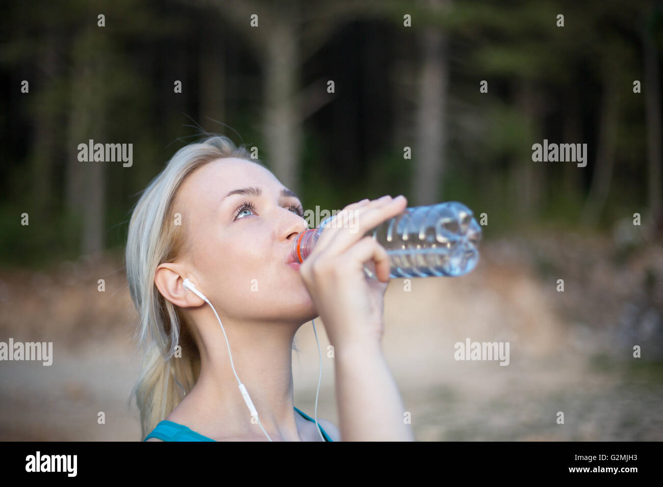 Woman Fitness Runner Drinking And Splashing Water In Her Face Funny woman-fitness-runner-drinking-and-splashing-water-in-her-face-funny