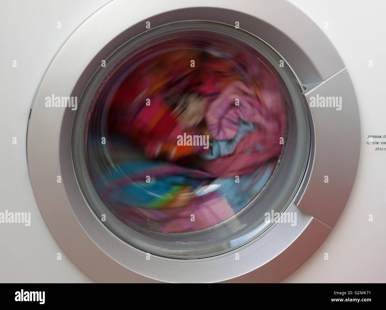 color laundry spin in a washmachine Stock Photo Alamy