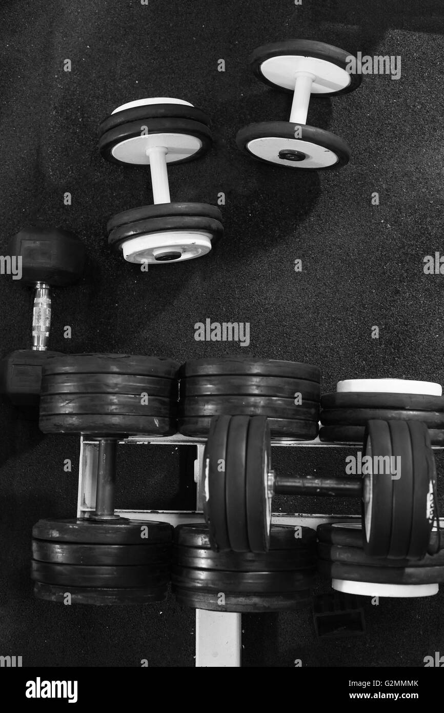 Sports dumbbells in sports club. Weight Training Equipment Stock Photo