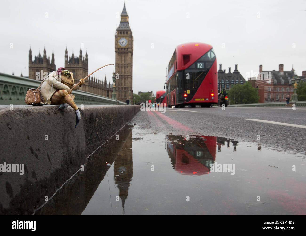 EDITORIAL USE ONLY A miniature sculpture of Beatrix Potter character Mr. Jeremy Fisher on Westminster Bridge in London, which has been updated for the 21st Century by street artist Marcus Crocker in celebration of the 150th anniversary of the author's birth. Stock Photo