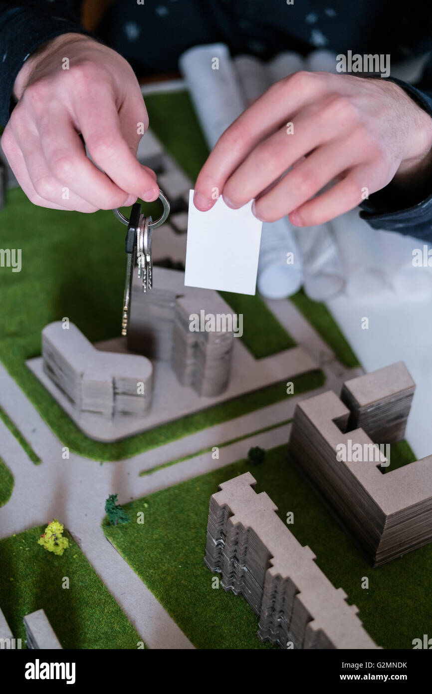 Model house, construction plan for house building, keys and clipboard ...